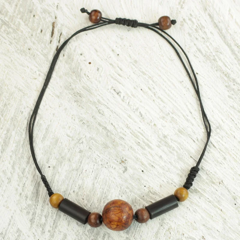 ---Round Might Sese Wood and Bamboo Cord Pendant Necklace from Ghana